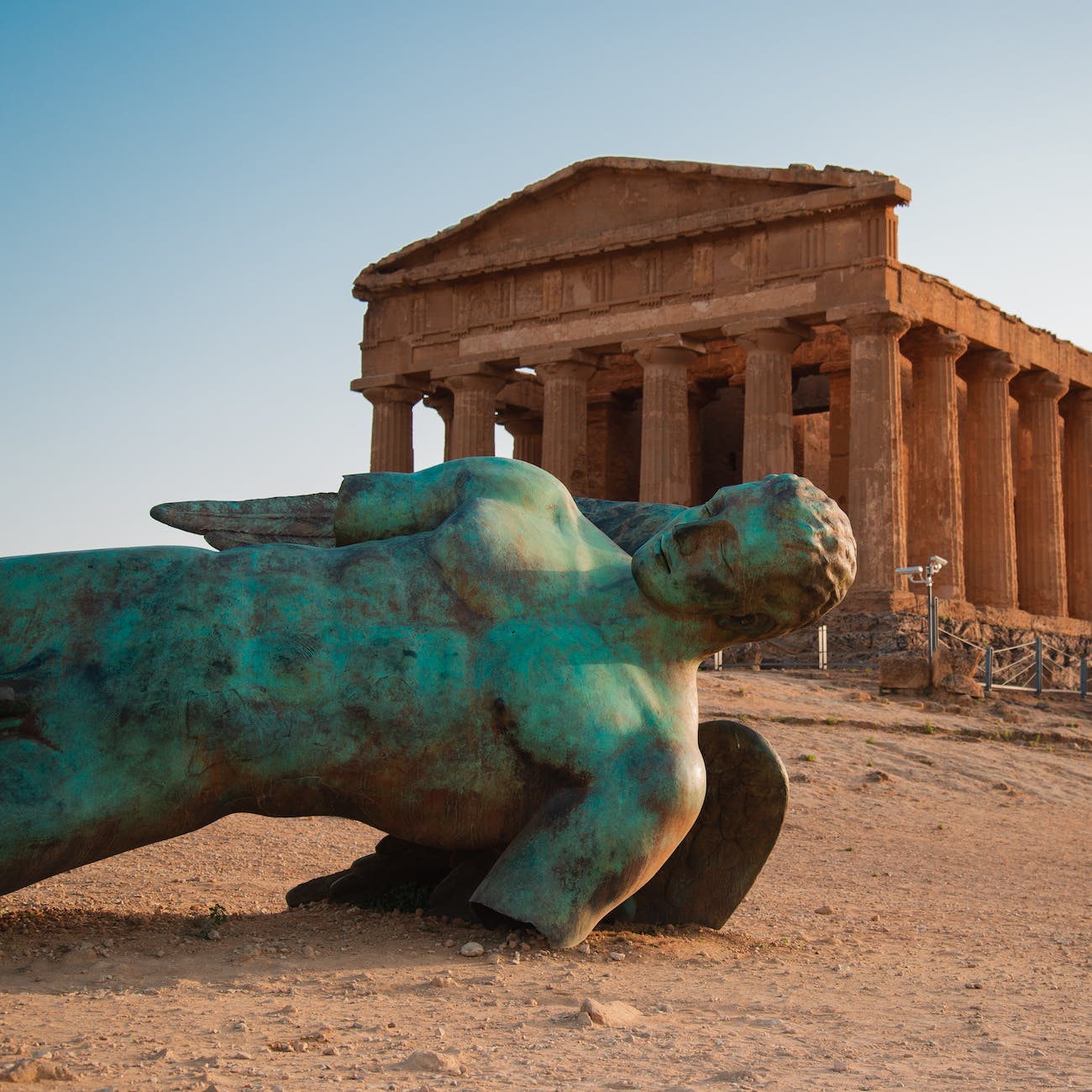 icarus statue in front of temple of concordia at agrigento valley of the temple sicily